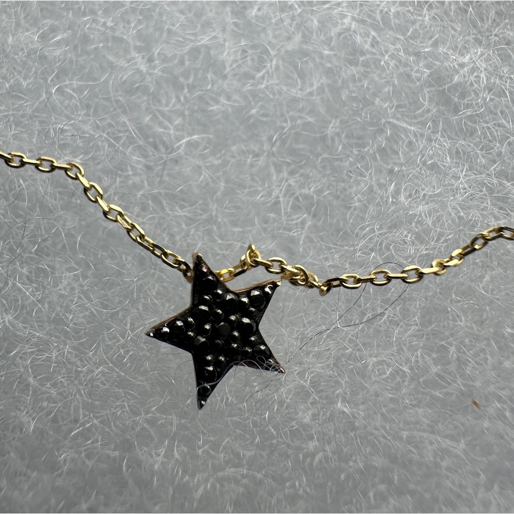 Black diamond star pendant on 14k gold chain